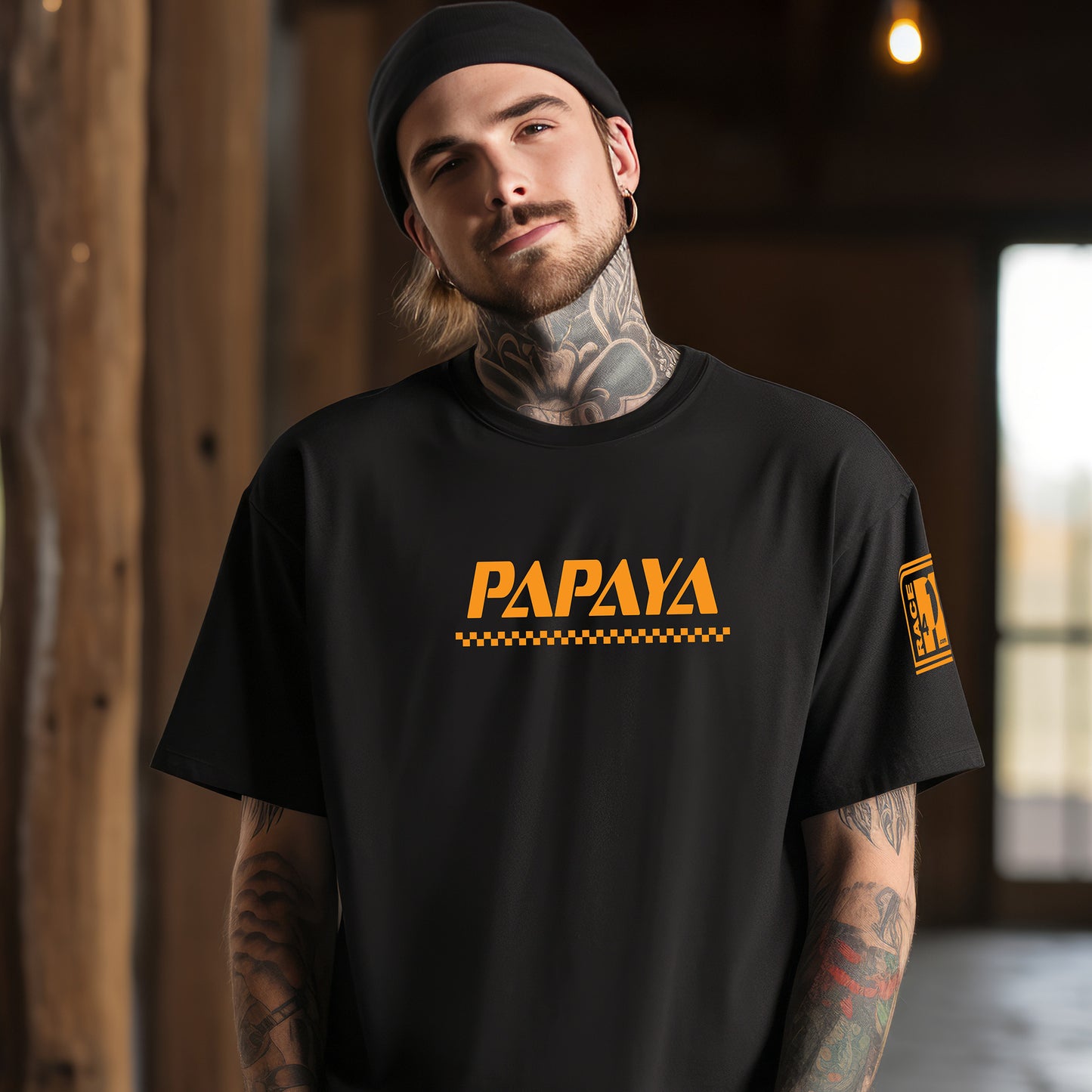 Man wearing PAPAYA wordmark black tee – Race4P1 Originals motorsport lifestyle tee with orange print