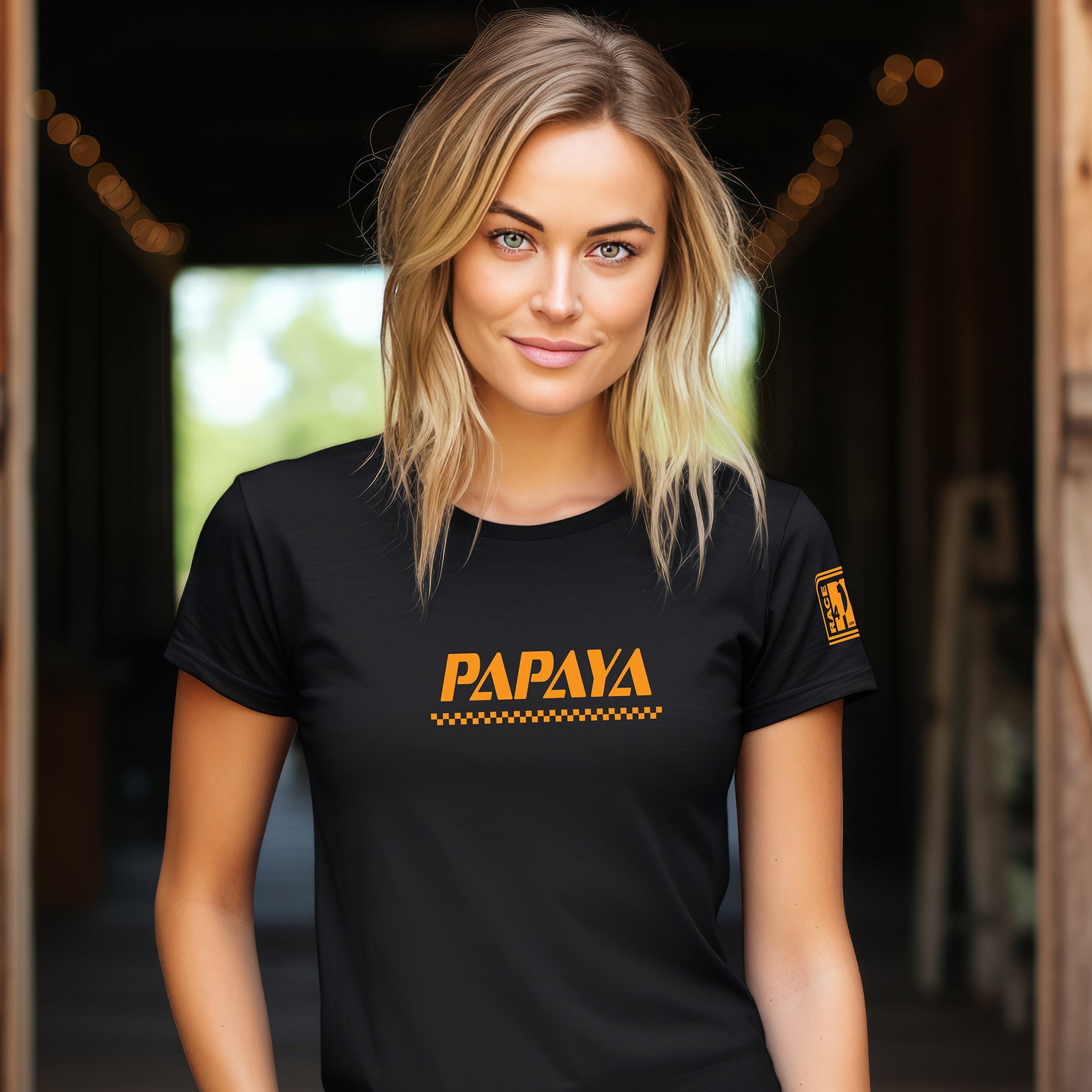 Woman wearing PAPAYA wordmark black tee – Race4P1 Originals motorsport lifestyle tee with orange print