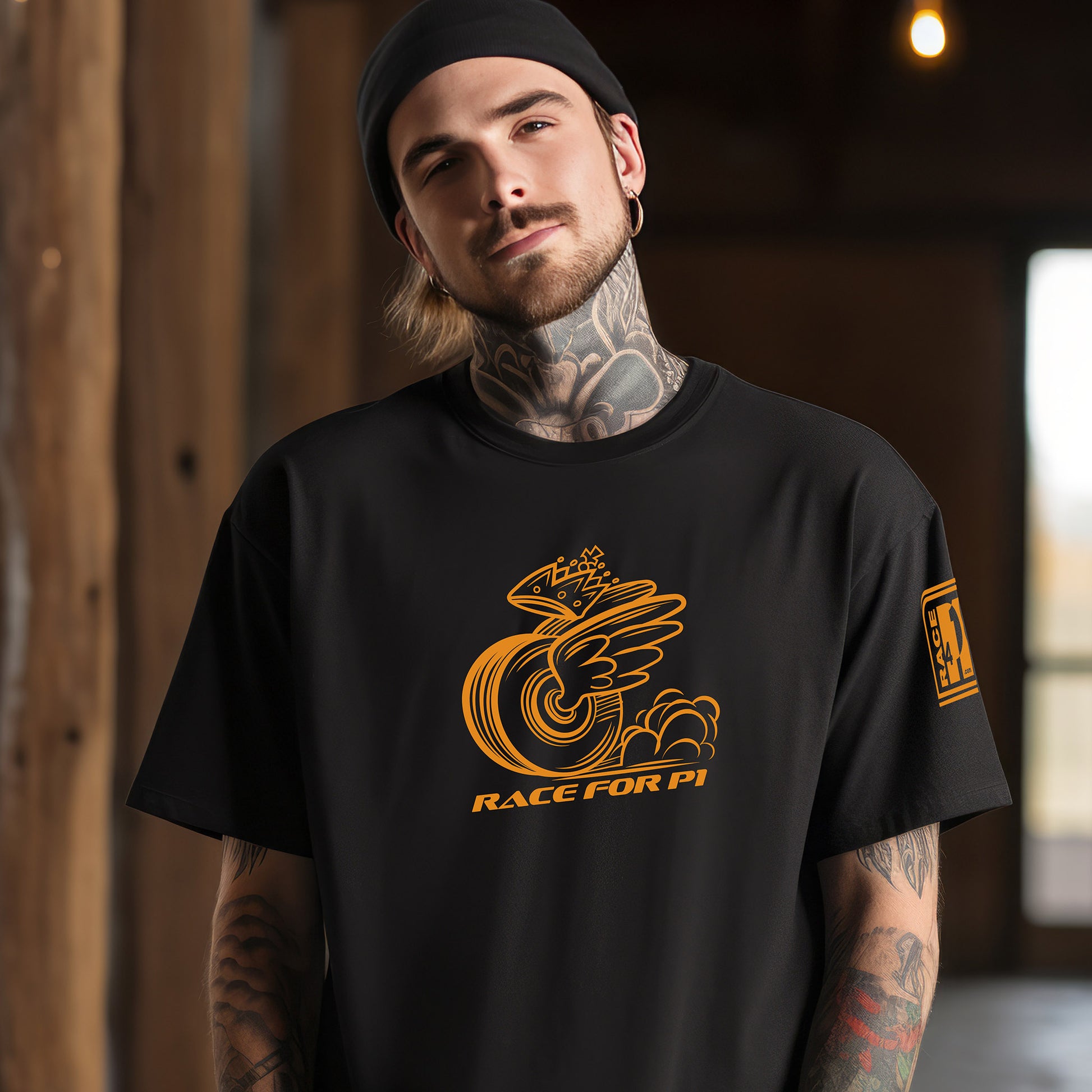 Man wearing RACE FOR P1 mascot black tee – Race4P1 Originals motorsport lifestyle tee with papaya orange print