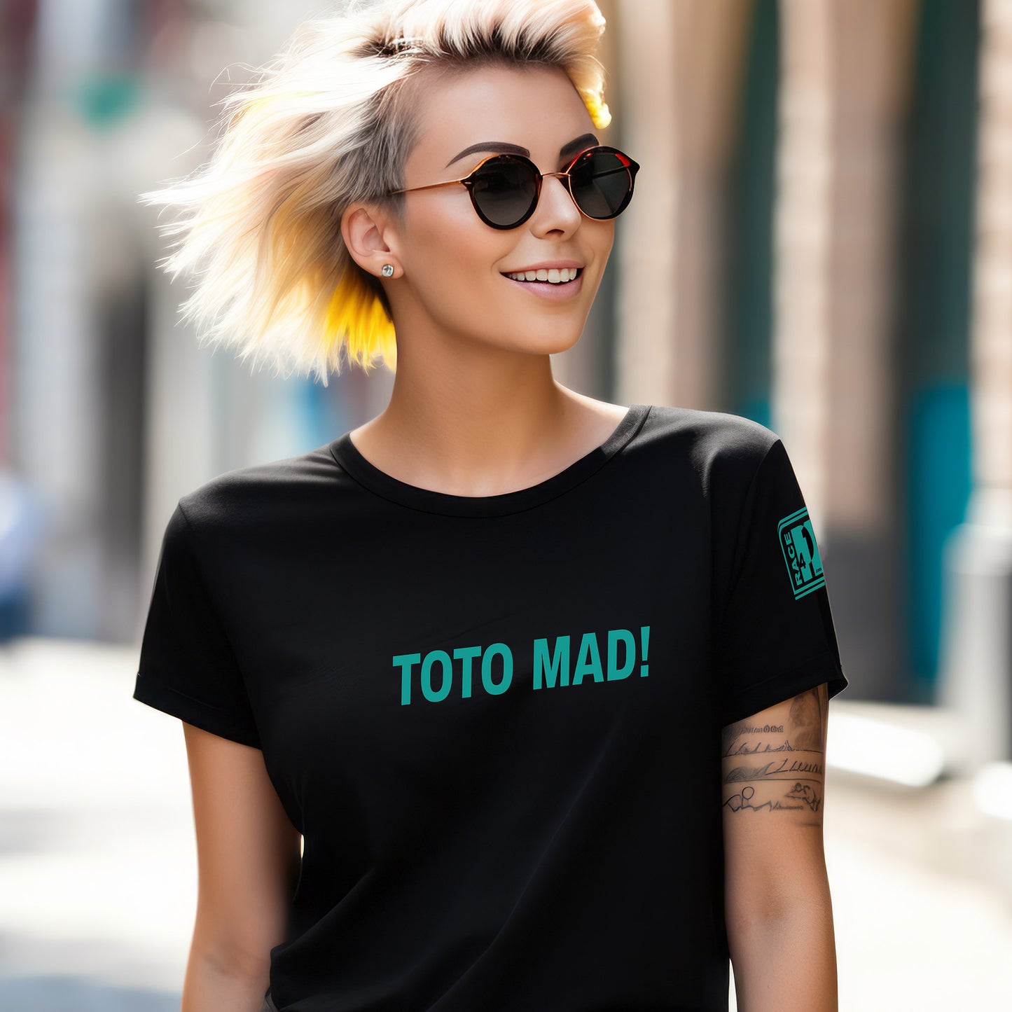 Woman wearing TOTO MAD! full chest black tee – Race4P1 Originals motorsport lifestyle tee with teal print